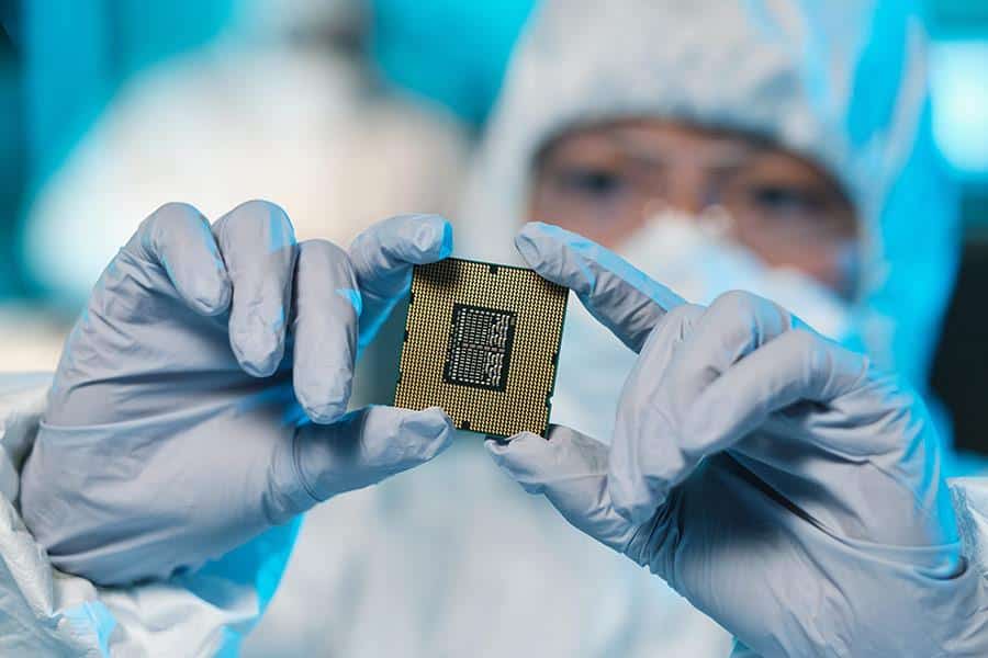Scientist holding semiconductor chip